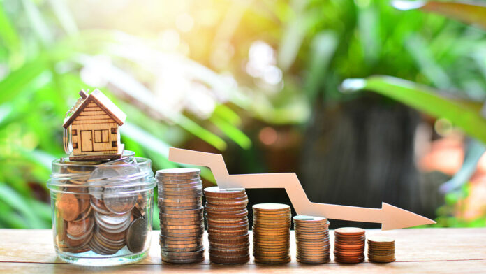 House,Model,On,Coins,Saving,Set,Decrease,Down,For,Concept